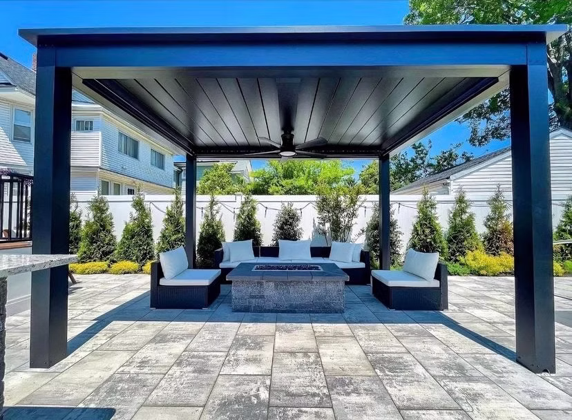 Black louvered patio cover over an outdoor lounge in Draper, Utah