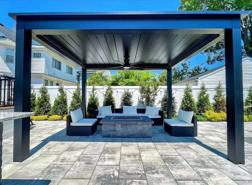 Black louvered patio cover over an outdoor lounge in Draper, Utah
