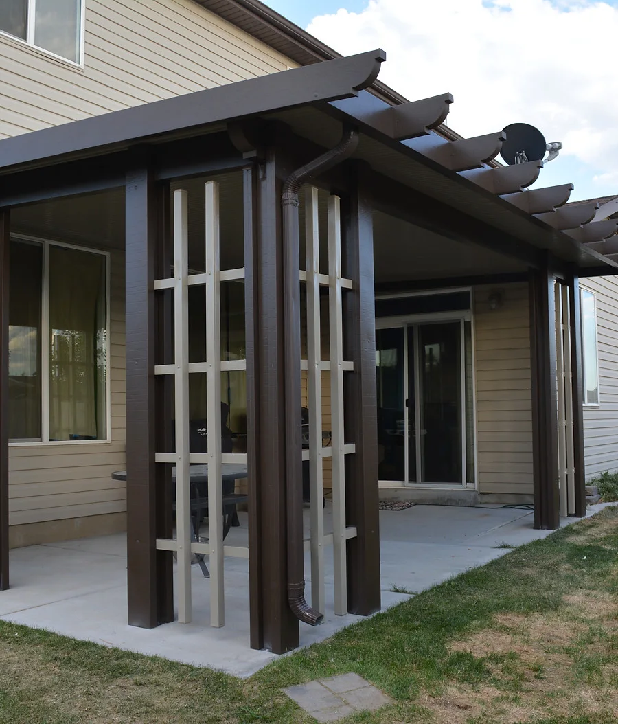White Newport-style patio cover beside a pool