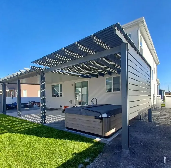 Modern backyard awning creating shade on a bright sunny day